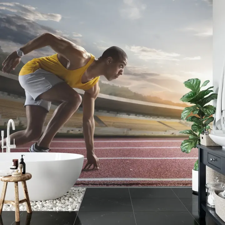 Fototapeta Sportowiec W Bloku Startowym – Dynamika Biegu na Stadionie