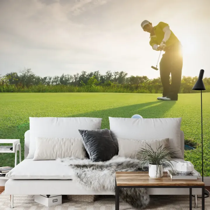 Fototapeta Golfista – Sportowa Elegancja na Polu Golfowym o Zachodzie Słońca