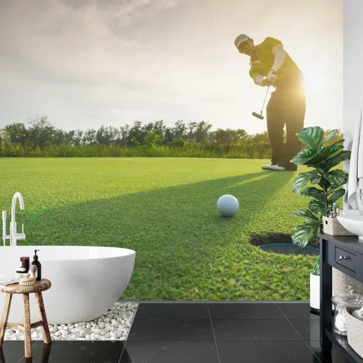 Fototapeta Golfista – Sportowa Elegancja na Polu Golfowym o Zachodzie Słońca